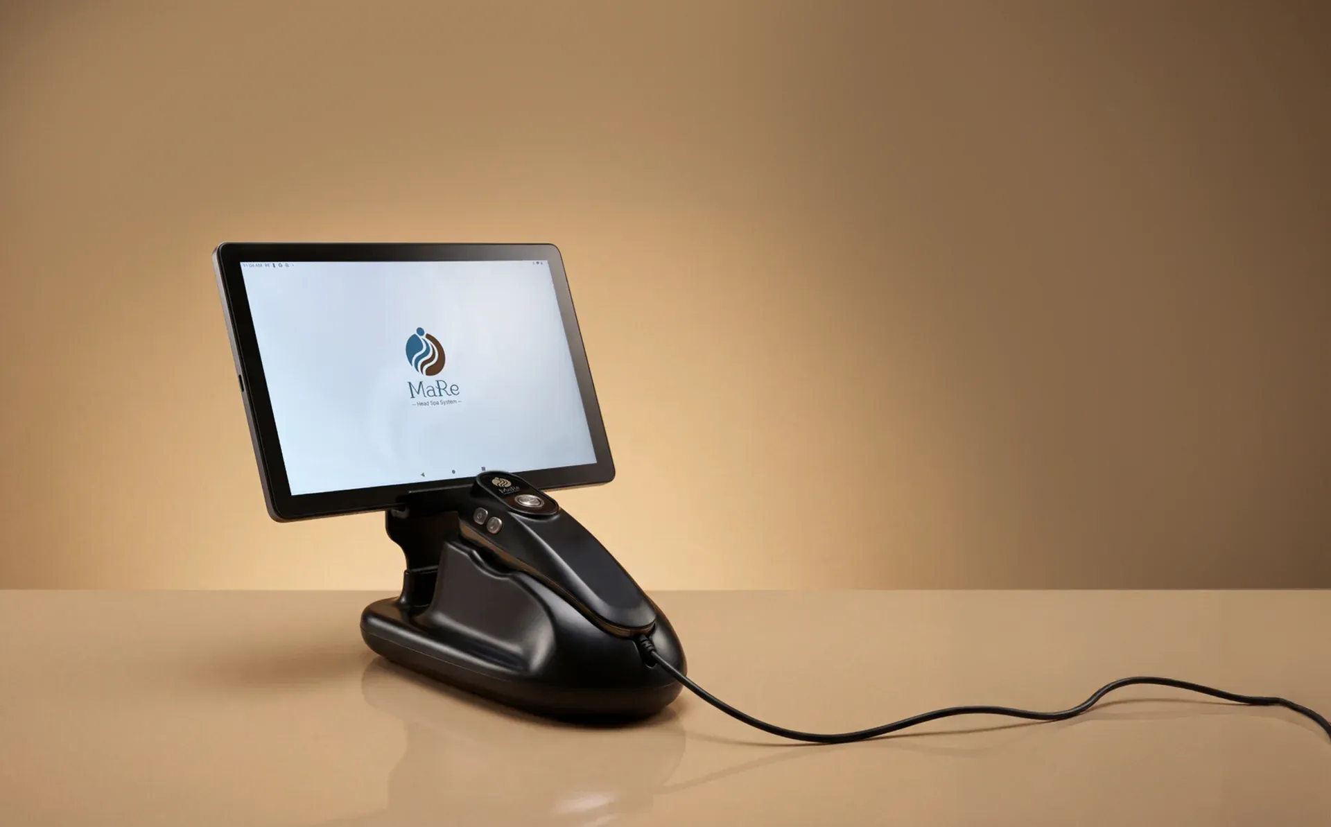 The MaRe Eye scalp camera and tablet on its charging stand